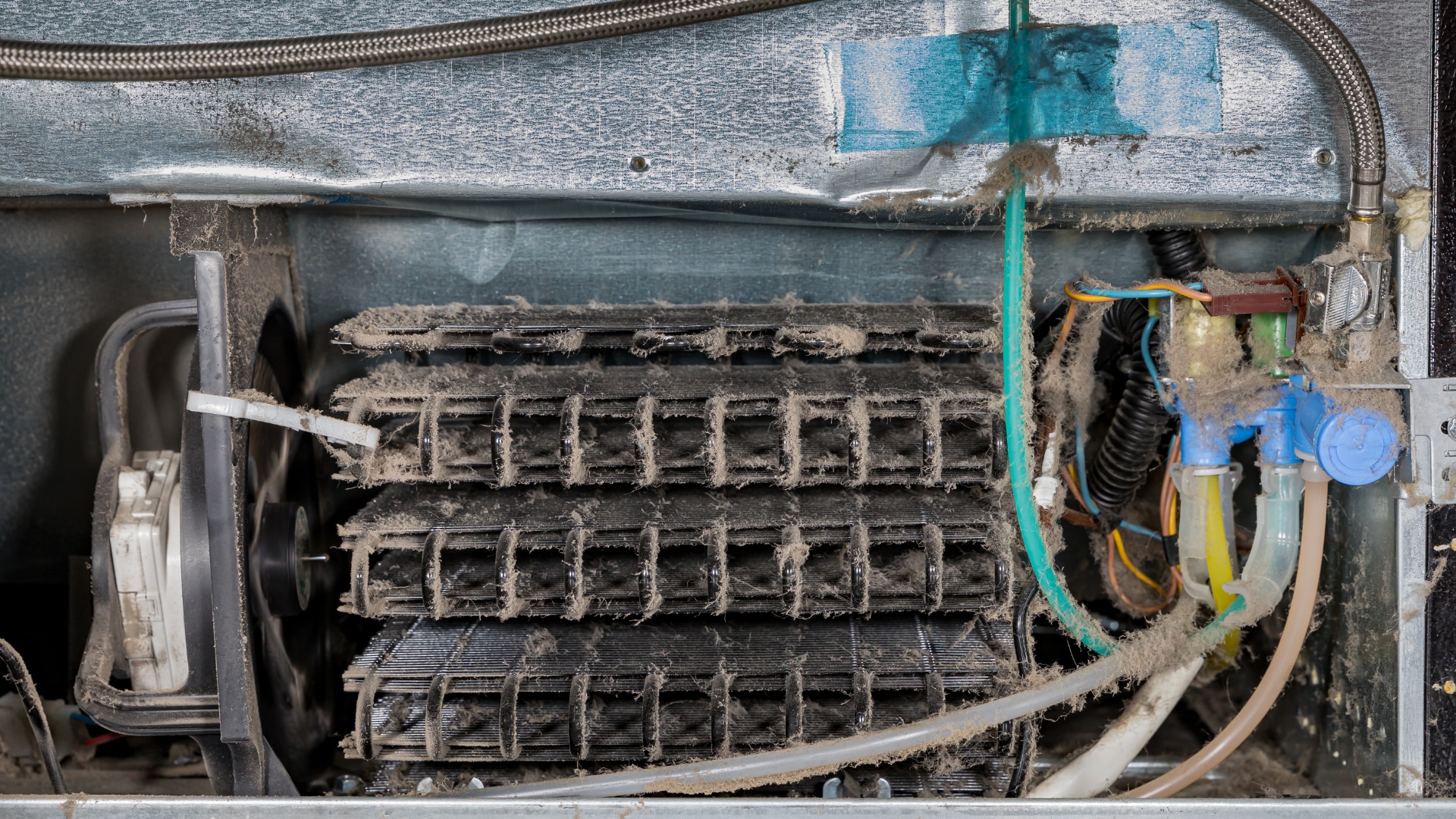 Cleaning the condenser coils of an Asko refrigerator