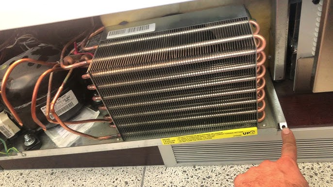 Cleaning the condenser coils of a wine cooler