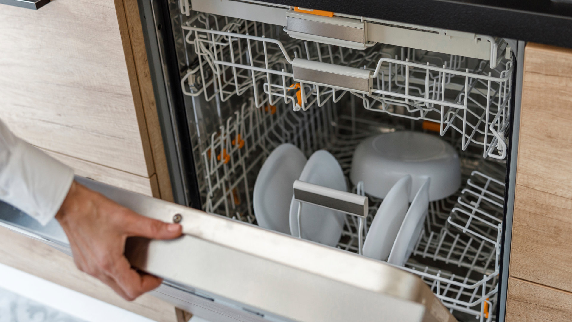 Inspecting the door latch of a dishwasher