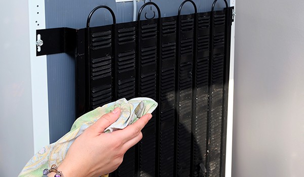 Cleaning the condenser coils of a Kirkland refrigerator