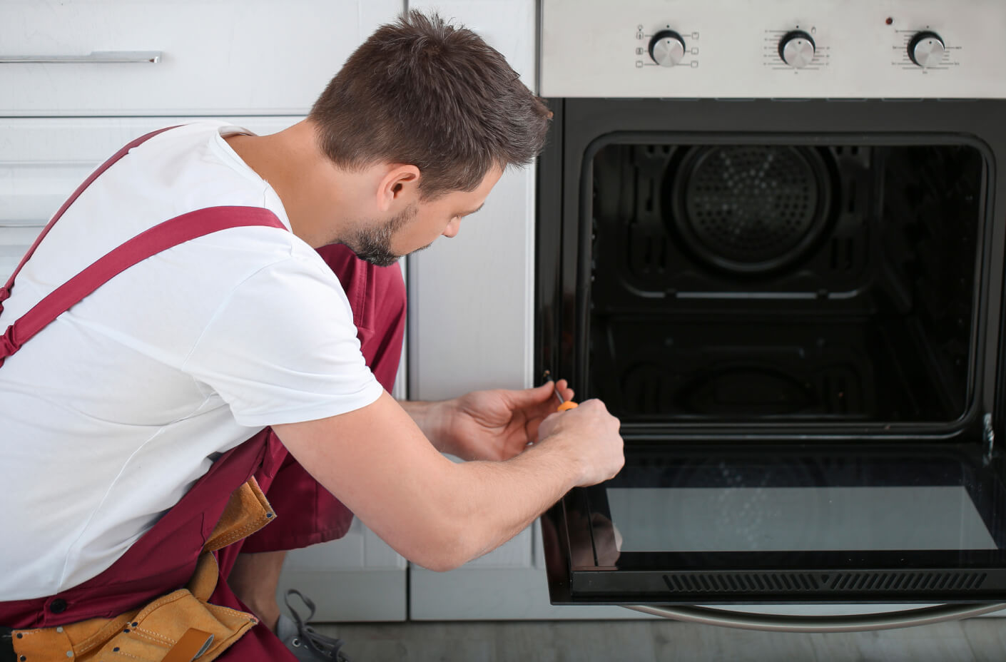 Tightening loose parts on an oven